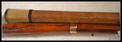 A pair of early 20th century Edwardian walking stick canes one having a tapering bamboo shaft with