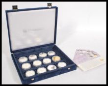 A collection of 12 x Queen Elizabeth II Jubilee silver 925 commemorative proof coins from the