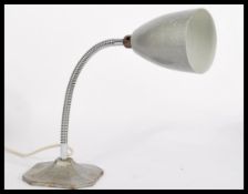 An vintage 20th century Industrial retro anglepoise lamp having a goose neck raised on a square base