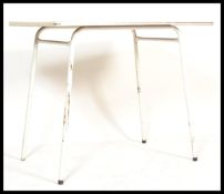 A vintage retro mid 20th Century dining table, the white ground laminated top decorated with streaks