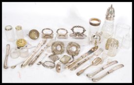 A large selection of silver plated and cut glass wares to include cruets, cutlery, trinket boxes,