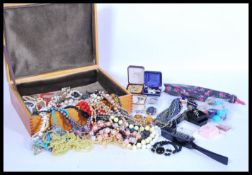 A selection of vintage costume jewellery to include a large selection of beaded necklaces,