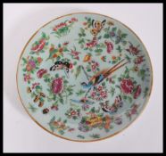 A 19th century Chinese Canton enamel charger plate having hand painted decoration of birds,