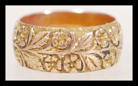 A 19th Century Victorian hallmarked 9ct gold band ring with engraved with floral detailing.