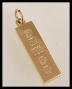 A hallmarked 9ct gold ingot pendant. Hallmarked London 1976. Total weight approx 31.3g.