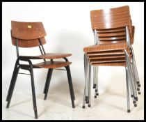 A collection of mid century retro tubular metal and wooden stacking chairs to include grey metal
