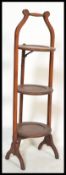 An Edwardian, early 20th cenutry mahogany 3 tier cake stand having shaped tiers complete with the