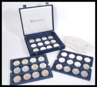 A cased collection of 36 x .999 Silver Eagle Westminster collectors Coins within capsules,