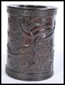A 20th Century Chinese hardwood brush pot having decoration of Koi carp with character marks.