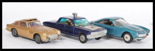 Three vintage Corgi & Politoys diecast model vehicles to include; Man From U.N.C.L.E Oldsmobile