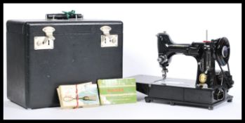 A vintage 20th century Singer Featherweight convertible portable sewing machine model number 222k