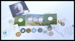 A collection of legaltender and silver proof coins, fourteen in total, all in capsules apart from