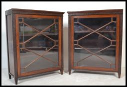 A pair of 19th century mahogany library bookcase cabinets. Each raised on stub legs with full length