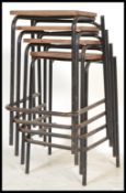A set of 4  retro 20th century stacking school / Industrial laboratory stools. The black metal