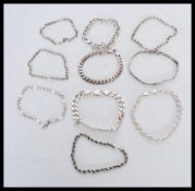 A collection of sterling silver bracelet chains to include a rope twist chain with lobster claw