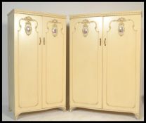 A pair of 20th century  Louis 16th style painted shabby chic ladies and gents wardrobes having