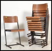 A collection / set of 8 20th century French heavy squared tubular metal and panel wood stacking