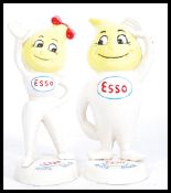 A pair of vintage cast iron advertising point of sale Esso money banks in the form of lemon headed