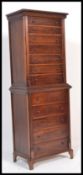 A mid 20th Century mahogany chest on chest / chest of drawers, having twelve drawers with turned