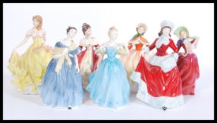 A collection of Royal Doulton ceramic figures to include Adrienne HN2304, Winter HN5314, Autumn