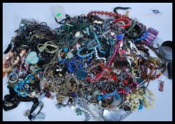 A collection of vintage costume jewellery to include a selection of mixed earrings, a coin bracelet,