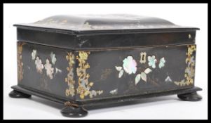 An early 20th Century Chinese lacquer box in the manner of Jennens and Bettridge being decorated