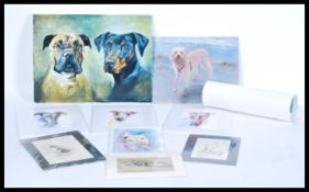 A selection of contemporary prints and paintings of dogs and cats to include a signed print by