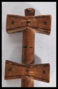 A vintage early 20th Century African tribal ceremonial staff, the shaft with geometric engravings