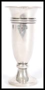A silver hallmarked stem vase of trumpet form raised on a round base. Hallmarked Birmingham 1958.