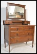 An early 20th Century Edwardian mahogany dressing table chest of drawers, swing mirror over three
