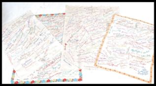 A selection of four embroidered cloths which have been signed by a wide range of early / mid 20th