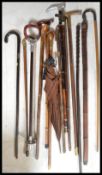 A collection of various designed walking canes dating from the late 19th / early 20th Century to