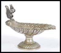 An early 20th Century silver plated electroplated Nut Dish The scallop-shaped bowl with embossed