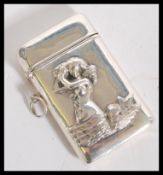 A sterling silver vesta match case having relief decoration depicting a mermaid. Stamped sterling
