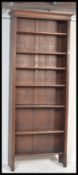 A tall Victorian oak 6ft + open window library bookcase cabinet having drawer base with tall shelves