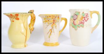 A Crown Ducal 1930's Art Deco vase together with a Charlotte Rhead inspired vase ( unmarked ) and