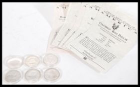 A collection of six  Silver Half Dollars dating from 1893 - 1982 in capsules with certificates to