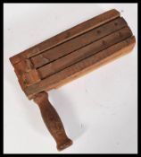 A vintage 20th century circa WWII / World War Two air raid / Football wooden clacker having