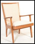A retro 20th Century mahogany hardwood open framed armchair, raised on tapering supports having open