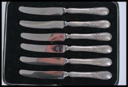 A set of six silver hallmarked handled knives complete in fitted case. Each handle bearing Sheffield