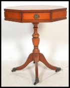 A Regency revival yew wood octagonal pedestal drum table of good quality being raised on castor