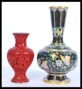 A vintage 20th Century Chinese Cloisonne vase on copper along with a Cinnabar lacquer baluster vase.
