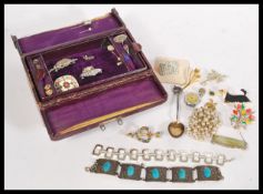 A collection of vintage costume jewellery contained within a vintage jewellery box. Includes