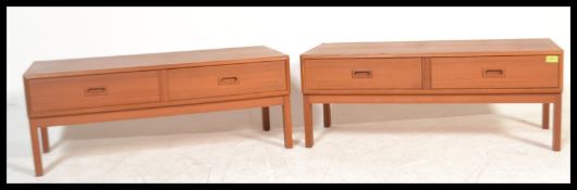 A pair of matching retro 20th Century teak wood Danish inspired low cabinets, each cabinet having
