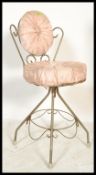 A retro vintage 20th century bedroom boudoir wire work dressing table chair having a scroll work