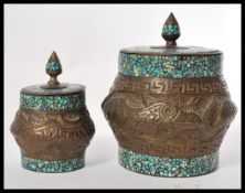 A graduating pair of early 20th Century Chinese caddies having embossed relief decoration of dragons