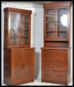 A pair of 1930's Art Deco mahogany library bookcase cabinets. Each being raised on plinth bases with