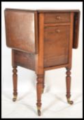 A mid 19th century Victorian ladies workbox table. Raised on turned legs with castors having a