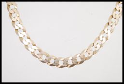 A hallmarked 9ct gold large curb link necklace chain having a lobster claw clasp. Measures 52cms