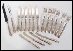 A selection of silver handled cutlery to include fish knives stamped JY hallmarked Sheffield 1926,